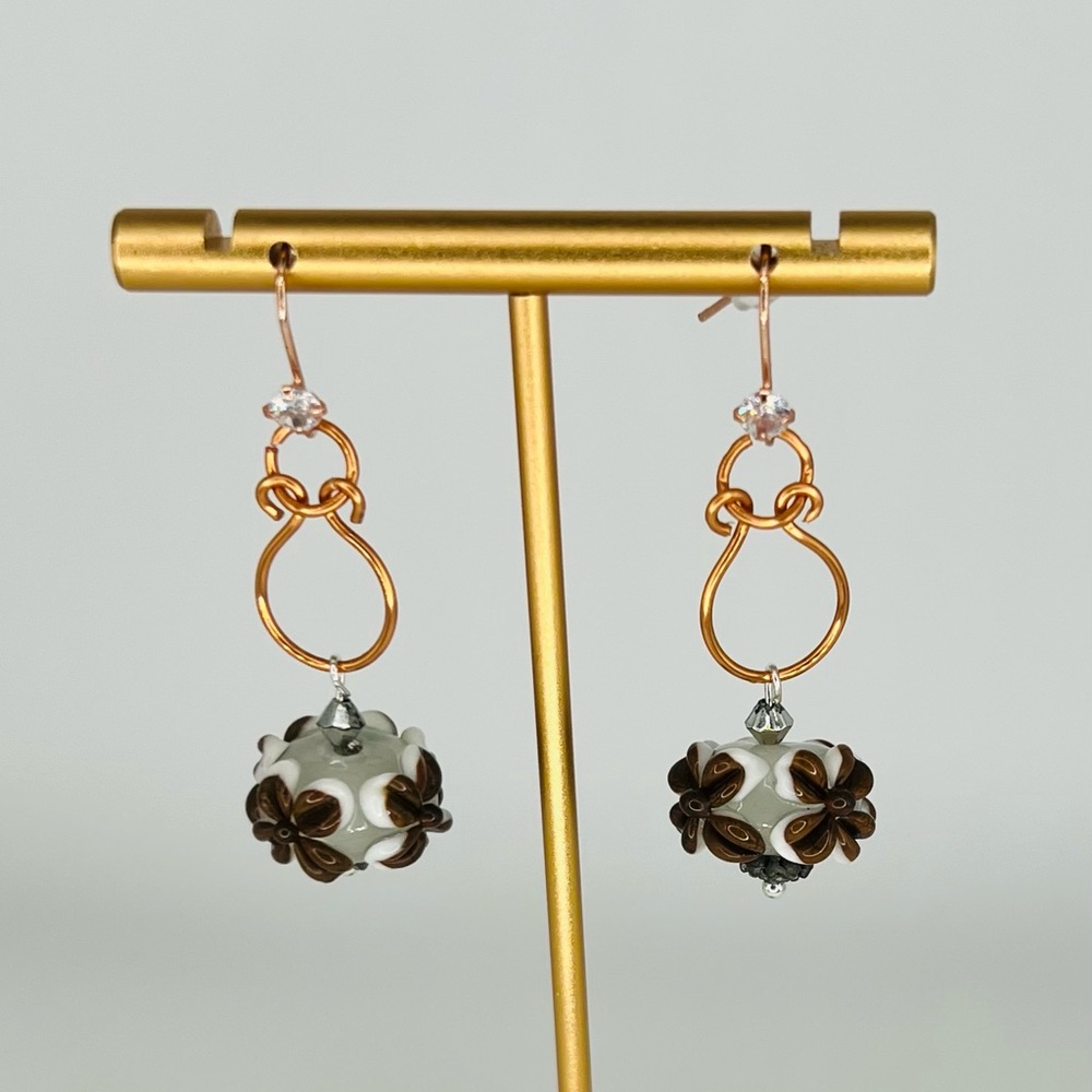Hand-Shaped Copper Wire Earrings with Brown and White Floral Bead